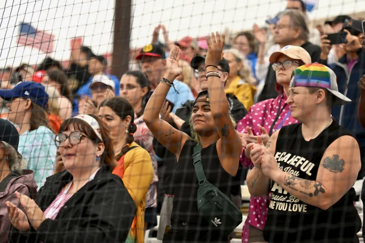 Women’s baseball league makes rainy debut
